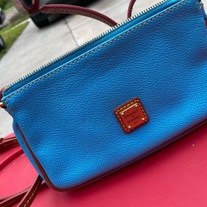 Dooney and Bourke crossbody in good condition. Ocean blue color all leather.